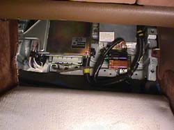 ECU exposed under wooden floorboard